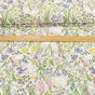 Směsové plátno 102530.1254.655, králíci v jarních květinách, zelená š.140cm (látka v metráži)