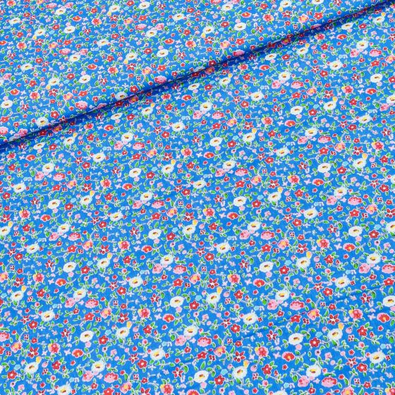 Bavlněné plátno BAREVNÉ KYTIČKY na modré, š.160cm (látka v metráži)