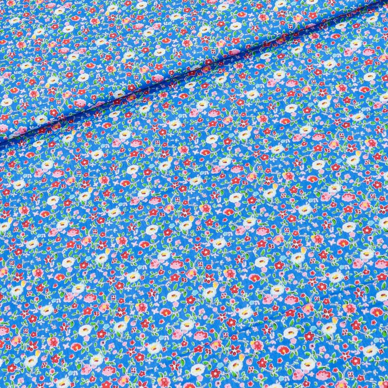 Bavlněné plátno BAREVNÉ KYTIČKY na modré, š.160cm (látka v metráži)