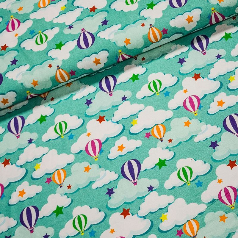 Bavlněný úplet dětský 88880702 létající balóny na zelené, š.150cm (látka v metráži)